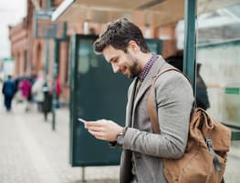 Businessman using smart phone at bus station Resume World - Technical/IT/Eng. Resumes